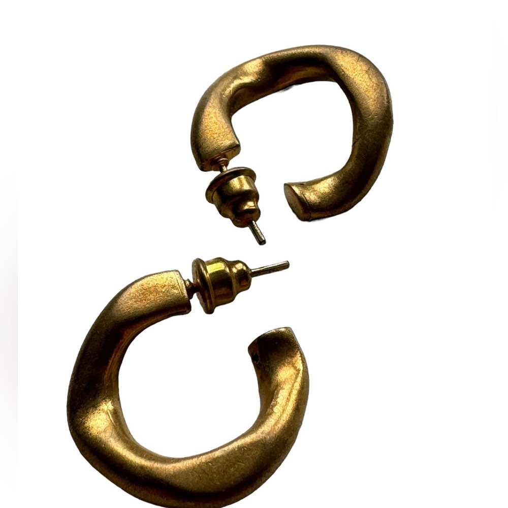 Gold tone open wavy hoop earrings. New.